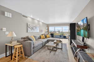 Living room with light wood-style floors and baseboards