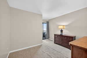 Bedroom with doors to balcony.