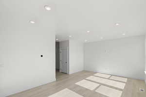 Unfurnished room featuring recessed lighting and light wood-style flooring