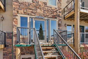 View of exterior entry with stone siding