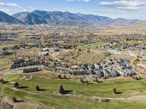 Aerial view of residential area featuring a water and mountain view
