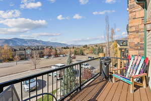 Balcony featuring a mountain view and a residential view