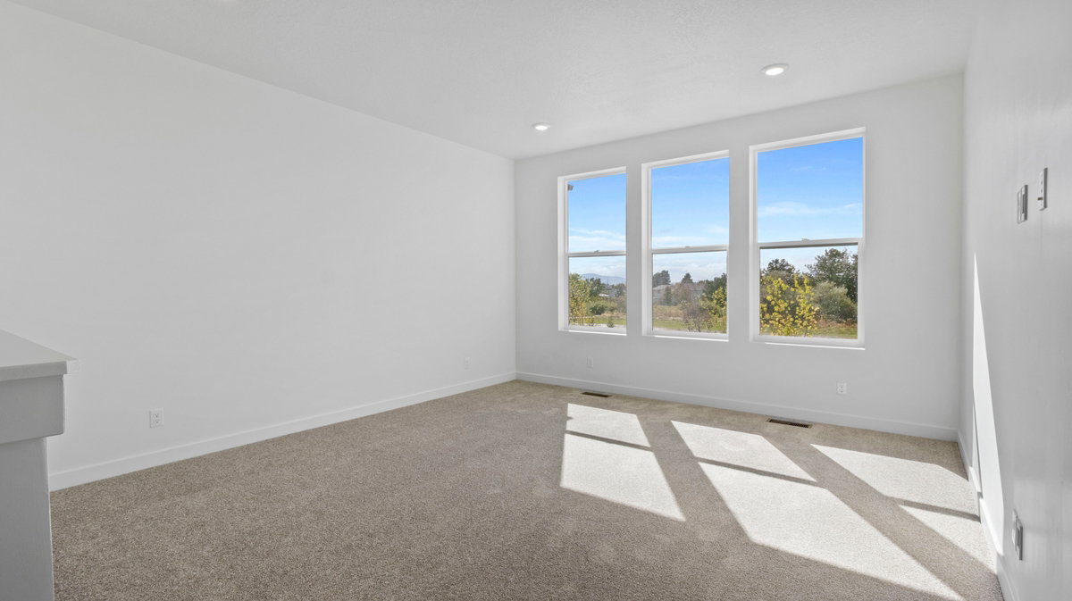 Unfurnished room with light carpet and recessed lighting