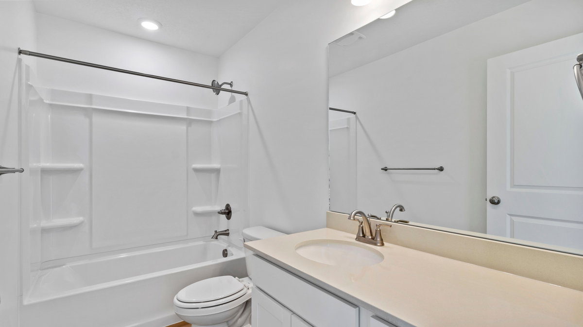 Full bath featuring tub / shower combination and vanity