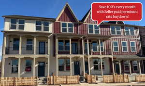 Craftsman inspired home with board and batten siding, a fenced front yard, and a porch