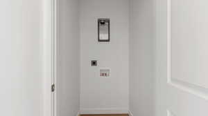 Laundry room featuring wood finished floors, hookup for an electric dryer, and hookup for a washing machine
