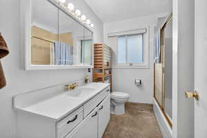 Bathroom featuring vanity and light colored carpet
