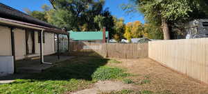 View of fenced backyard