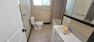 Bathroom featuring vanity and light tile patterned flooring
