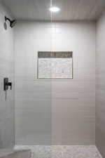 Full bathroom with a walk in shower and recessed lighting