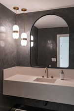 Bathroom featuring vanity and a textured ceiling