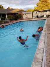 Community pool featuring a patio and a mountain view