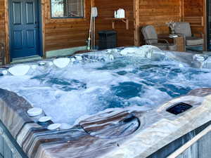 Exterior space with a hot tub