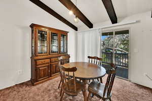 Dining space with light colored carpet