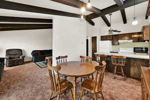 Dining room featuring light carpet