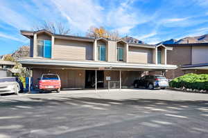 View of front of home with covered parking and a mountain view
