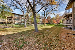 View of green lawn with a balcony