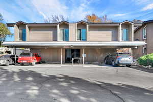 View of front facade with covered parking