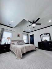 Primary bedroom with carpet flooring, a ceiling fan, recessed lighting, a textured ceiling, and crown molding