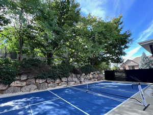 View of pickleball court featuring a patio