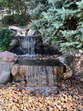 View of waterfall feature in backyard