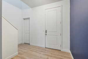 Entryway with light wood-style flooring