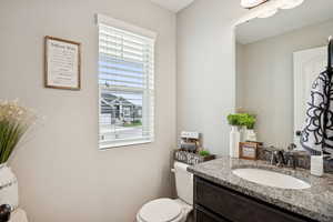 Bathroom featuring toilet and vanity