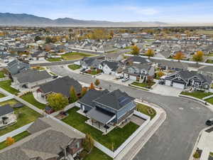 Aerial perspective of suburban area featuring a mountain backdrop