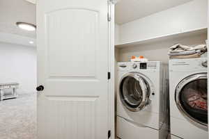 Laundry area featuring carpet and independent washer and dryer