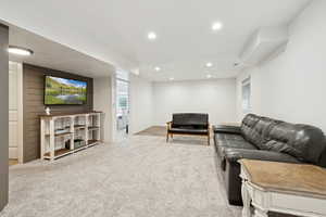 Living room featuring light carpet and recessed lighting