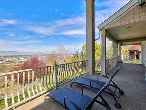 Balcony featuring a sunroom
