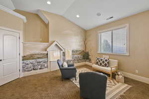 Living area with vaulted ceiling, carpet, and recessed lighting
