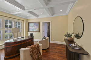 Home office with dark wood finished floors, beamed ceiling, coffered ceiling, recessed lighting, and crown molding