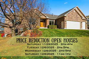 View of front of house with a front yard, a garage, stone siding, brick siding, and a shingled roof