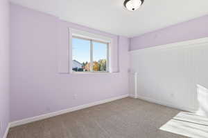 Bedroom 6 featuring carpet and baseboards