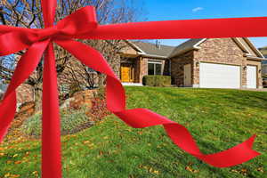Exterior view of a downspout, gutters, and stone siding