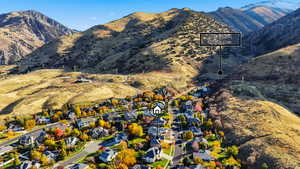 View of mountain background featuring nearby suburban area