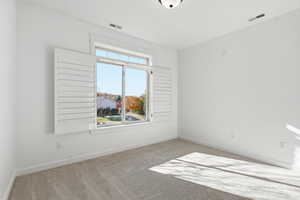 Carpeted bedroom 2 with baseboards