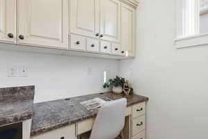 Office with built in study area in laundry room