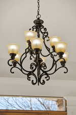 Detailed view of ornamental molding and a chandelier