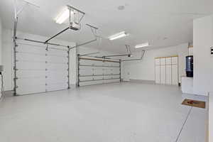 3 car garage with built in cabinets a BRAND NEW EPOXY FLOOR!