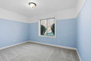 Bedroom 5 featuring carpet flooring and baseboards