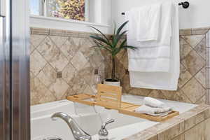 Primary Bathroom featuring a bath