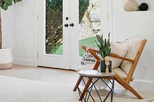 Sitting room with light colored carpet