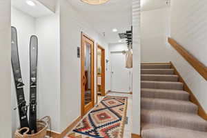 Entry from heated garage (Not pictured is owner's lockout closet at bottom of stairs and additional storage closet under the stairs)