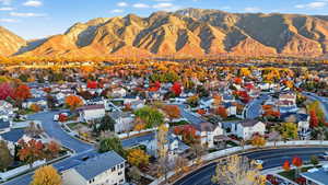 Aerial perspective of suburban area featuring a mountain backdrop