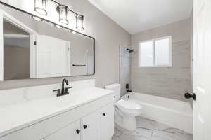 Full bath with vanity, shower / washtub combination, and light marble finish floors