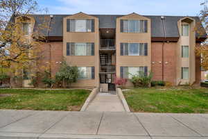 View of apartment building / complex featuring stairway