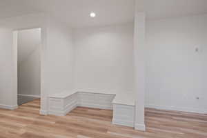 Spare room with light wood-style floors and recessed lighting