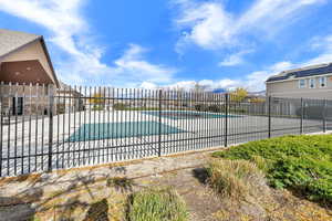 Community pool featuring a patio